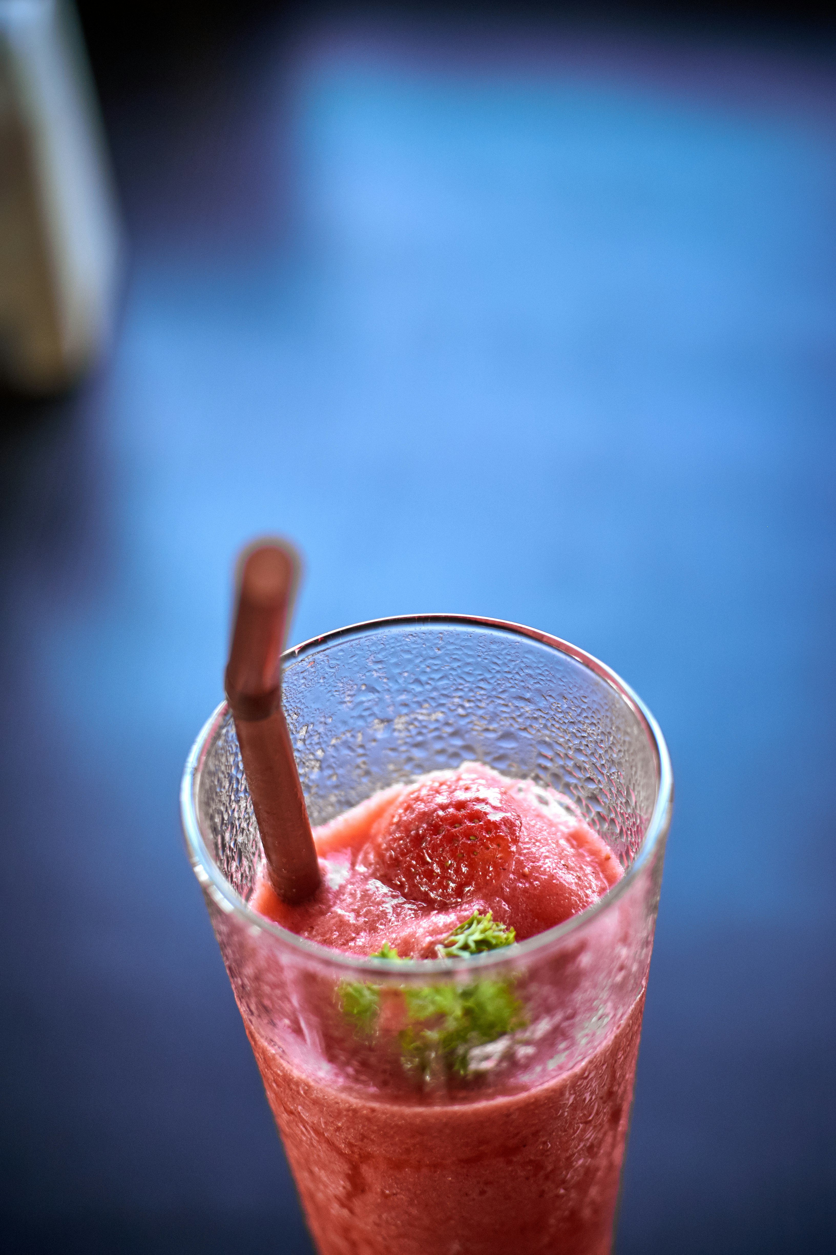 clear drinking glass with strawberry juice